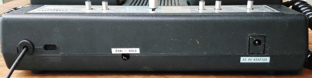 Rear: RF lead, HORI - HOLD adjustment hole and the AC 9V ADAPTOR socket
